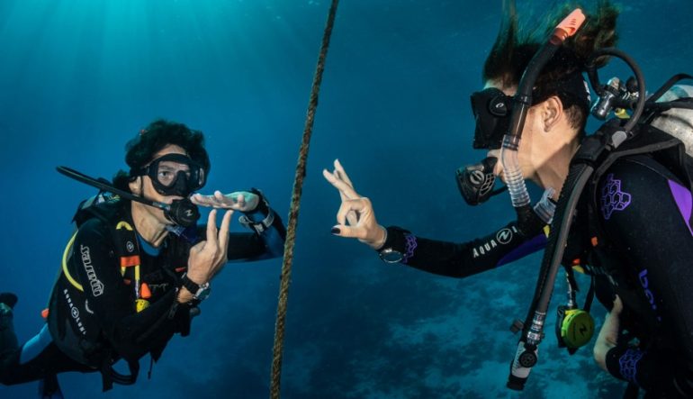 Mastering Hand Signals: How to Communicate Underwater When Scuba Diving